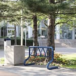 custom colored public bike securing rack out side a library in an university