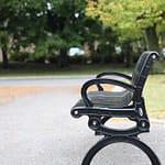 commemorative commercial metal bench for gardens and parks located in a quiet and clean community