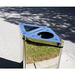 Outdoor stainless-steel recycling receptacles in a custom bin combination is doing its job on the street