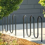 2 steel school bike parking racks are installed on an university campus