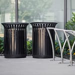 2 black classic commercial park outdoor trash cans outside a business center in downtown Toronto