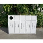 custom 5-unit commercial steel recycling receptacle in the garden outside an office building