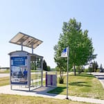 Recycling receptacle Commercial Park Recycling Bin CRC-814-a is in service at a bus stop in the City of Cold Lake